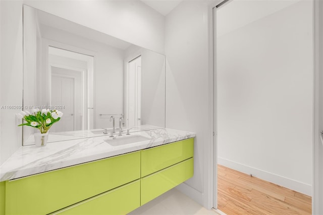 bathroom featuring vanity and hardwood / wood-style flooring