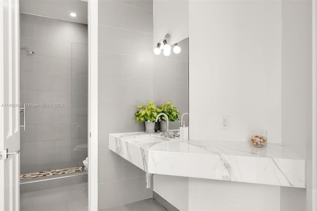 bathroom featuring tile patterned flooring and toilet