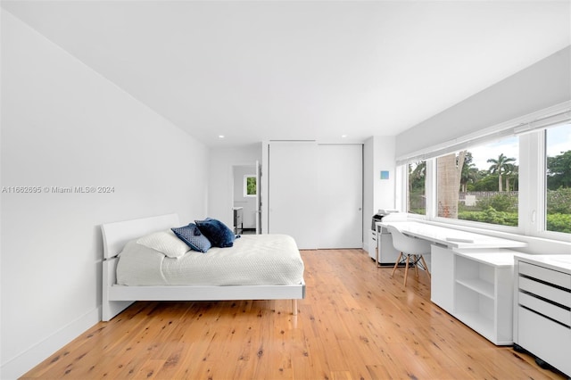 bedroom with light hardwood / wood-style flooring