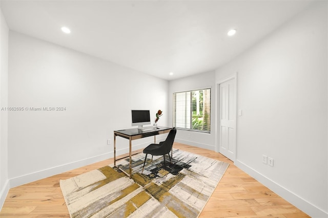 office area with light hardwood / wood-style floors