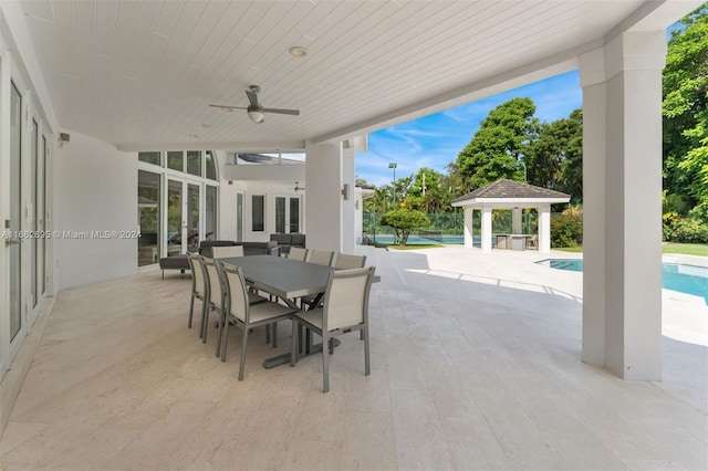 view of patio / terrace featuring a gazebo and ceiling fan