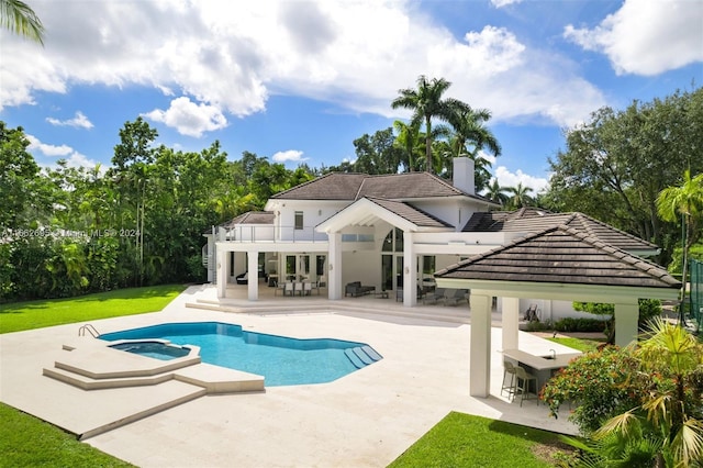 view of swimming pool featuring a patio area and a yard