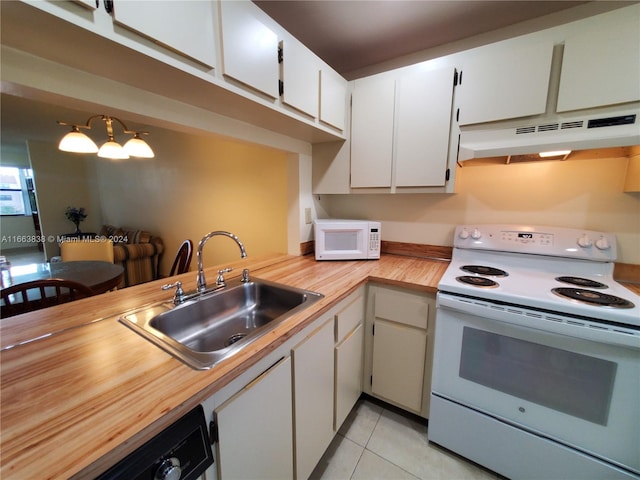 kitchen featuring a chandelier, light tile patterned flooring, sink, white cabinets, and white appliances