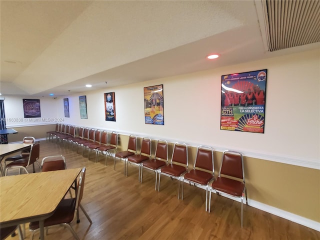 dining space with hardwood / wood-style floors