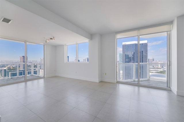 tiled empty room with expansive windows