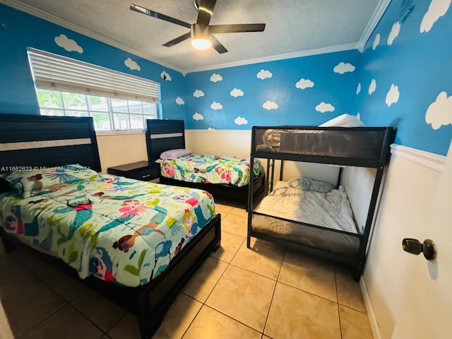 bedroom featuring crown molding, tile patterned flooring, a textured ceiling, and ceiling fan