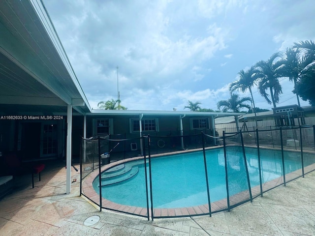 view of pool featuring a patio