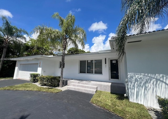 single story home featuring a garage