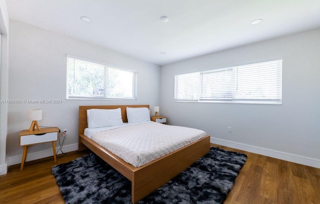 bedroom with hardwood / wood-style flooring