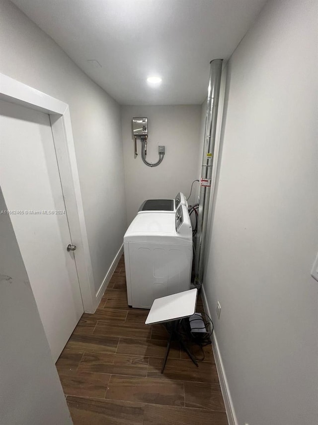 laundry area featuring washer / clothes dryer and dark hardwood / wood-style flooring