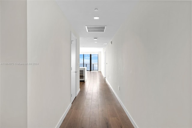 corridor with dark wood-type flooring