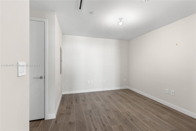 empty room featuring hardwood / wood-style flooring