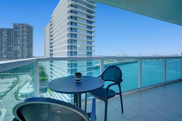 balcony featuring a water view