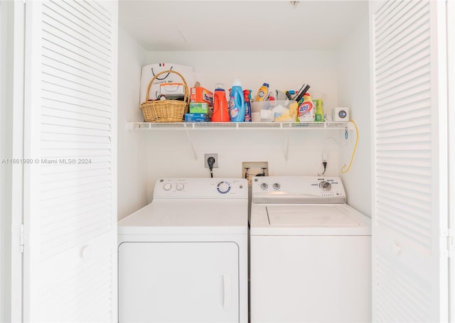 laundry area with independent washer and dryer