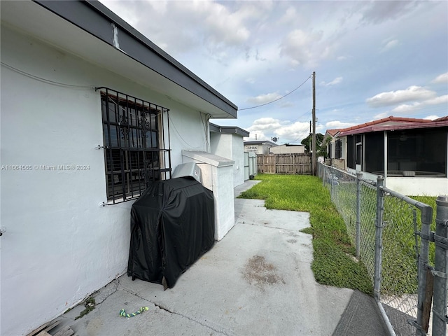 view of patio featuring a grill