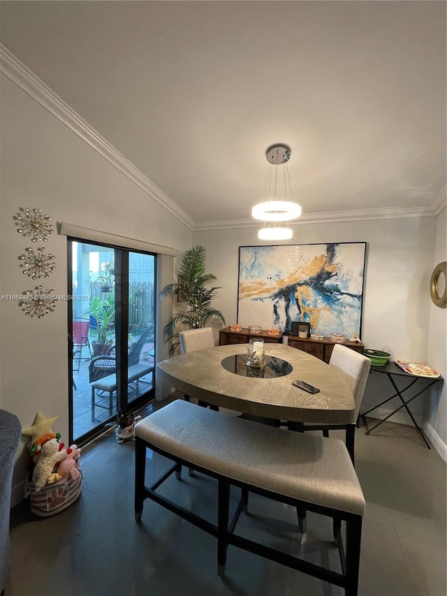 dining space with vaulted ceiling and crown molding