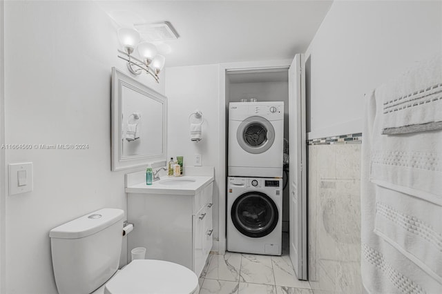 laundry room with stacked washer / dryer and sink