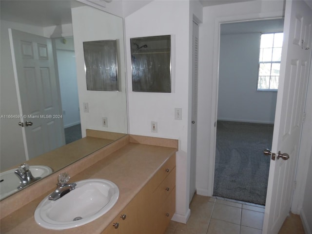 bathroom with tile patterned floors and vanity