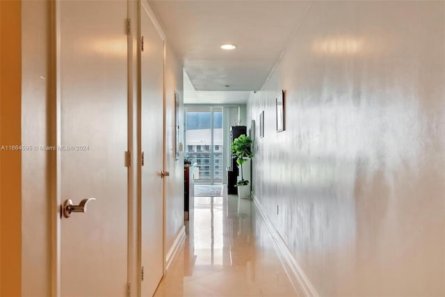 hallway featuring light tile patterned floors