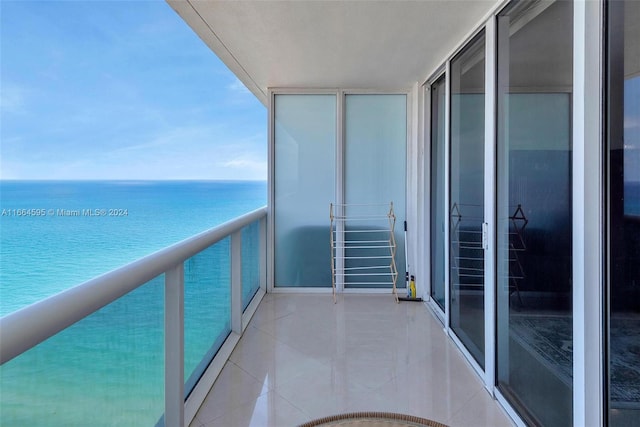 balcony featuring a water view