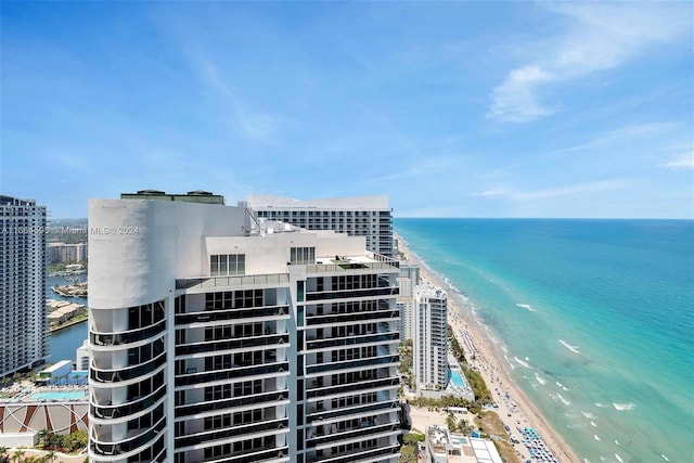 view of property featuring a water view and a view of the beach