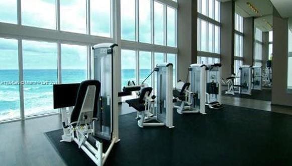 gym with floor to ceiling windows