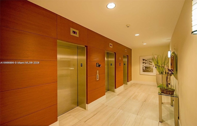 1861 NW S River Dr Unit 1404, Miami, FL 33125 - hall with recessed lighting, elevator, and light tile patterned floors
