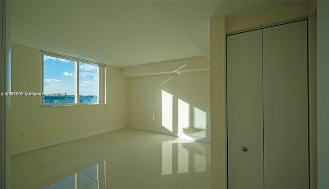 unfurnished bedroom featuring a closet and tile patterned floors