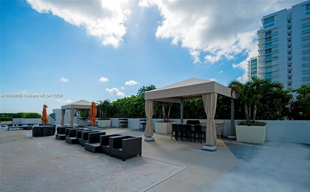 view of patio with a gazebo and exterior bar