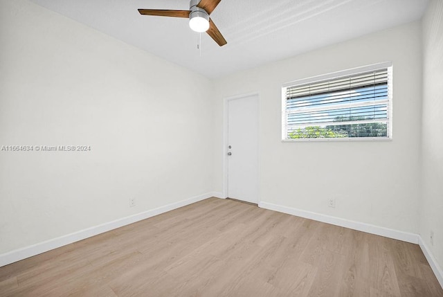 spare room with light hardwood / wood-style floors and ceiling fan