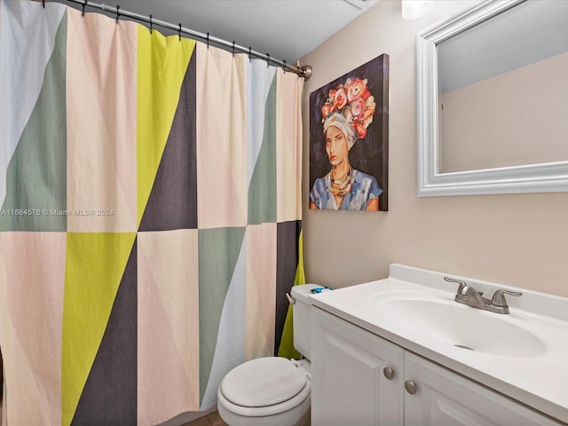 bathroom with walk in shower, vanity, and toilet