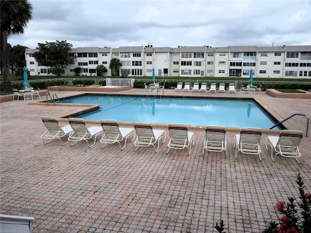 view of swimming pool with a patio