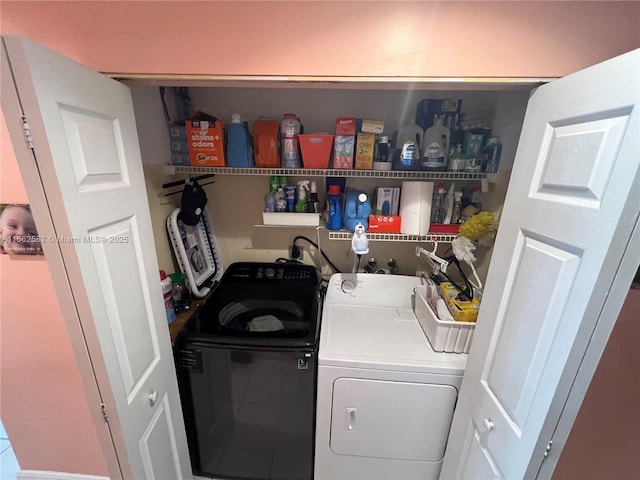 laundry area with washing machine and dryer