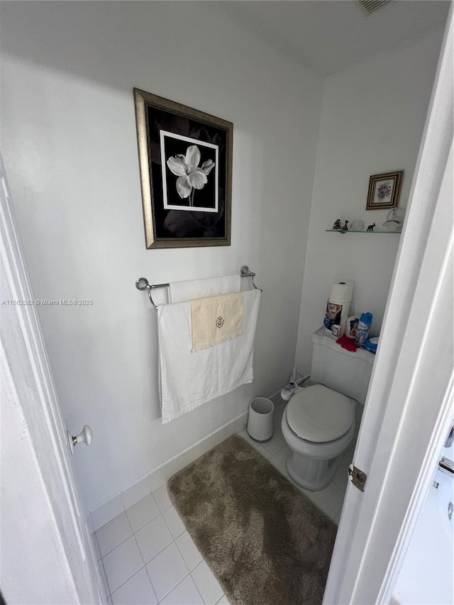 bathroom with tile patterned flooring and toilet