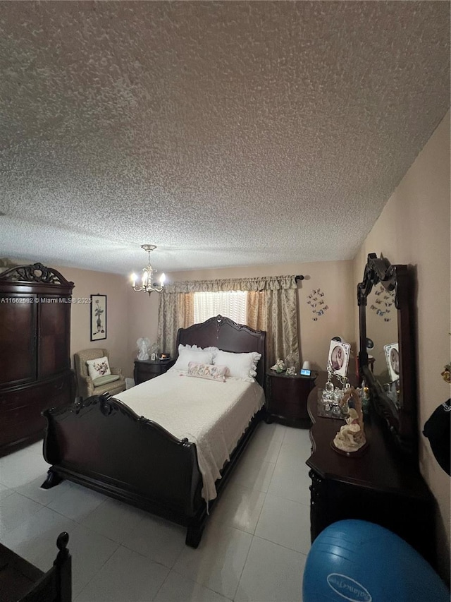 bedroom featuring a textured ceiling and a chandelier