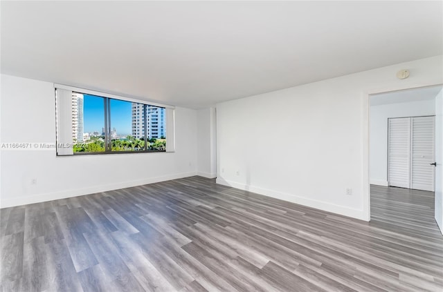 empty room with hardwood / wood-style floors