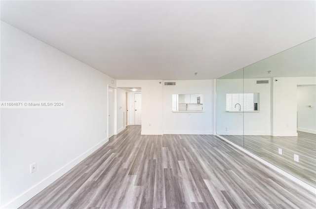 unfurnished living room with light hardwood / wood-style floors