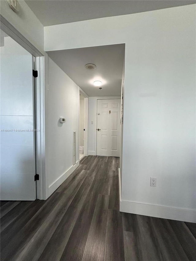 hallway featuring dark hardwood / wood-style floors