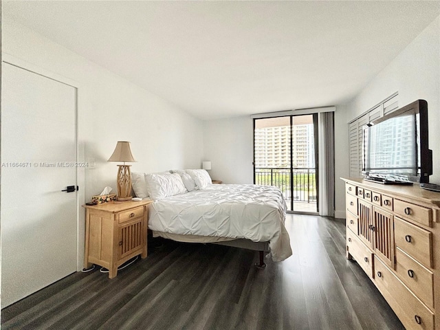 bedroom featuring dark hardwood / wood-style floors and access to exterior