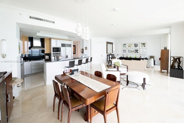 dining room with ornamental molding