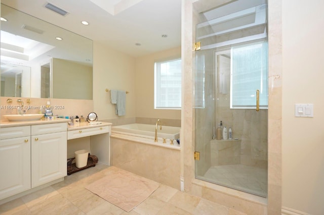 bathroom featuring vanity, independent shower and bath, and tasteful backsplash