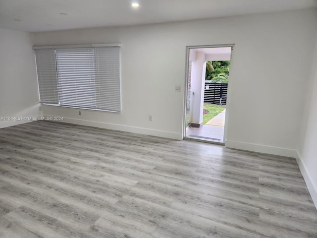 spare room featuring light hardwood / wood-style floors