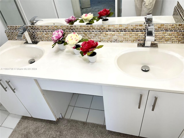 bathroom with vanity, backsplash, and tile patterned floors