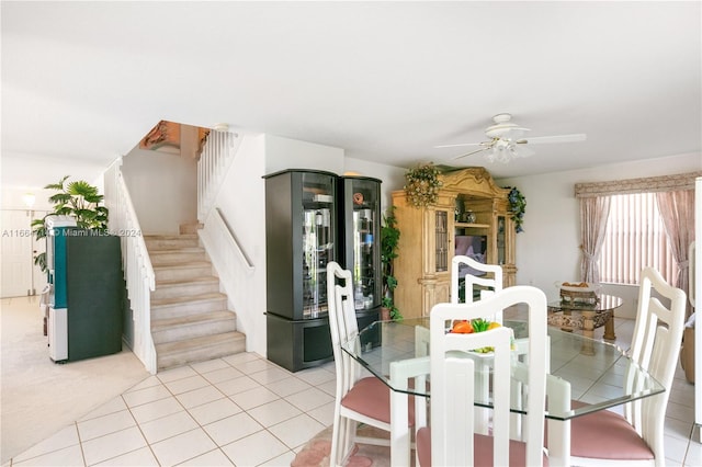 tiled dining room featuring ceiling fan