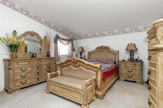 bedroom featuring light colored carpet