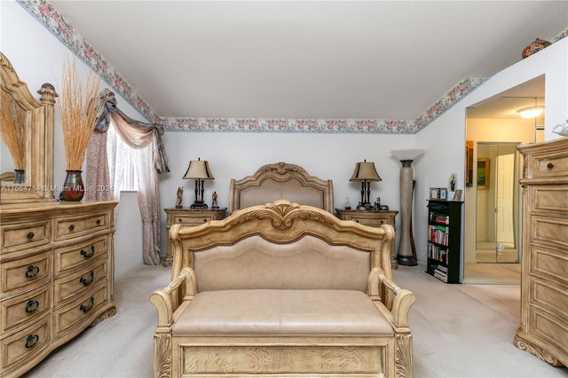 bedroom featuring light colored carpet