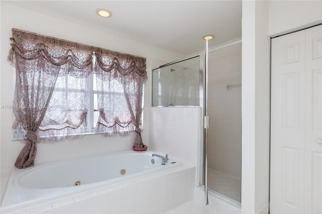 bathroom with tile patterned floors and separate shower and tub