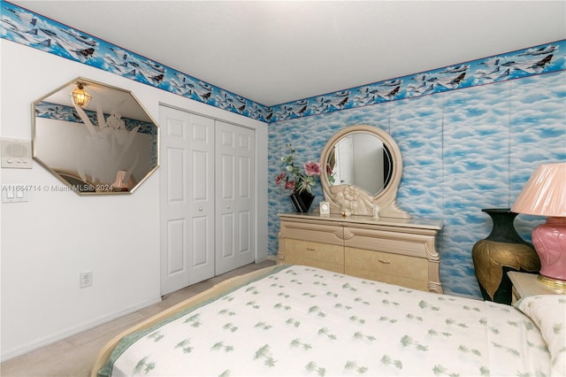 carpeted bedroom featuring a closet