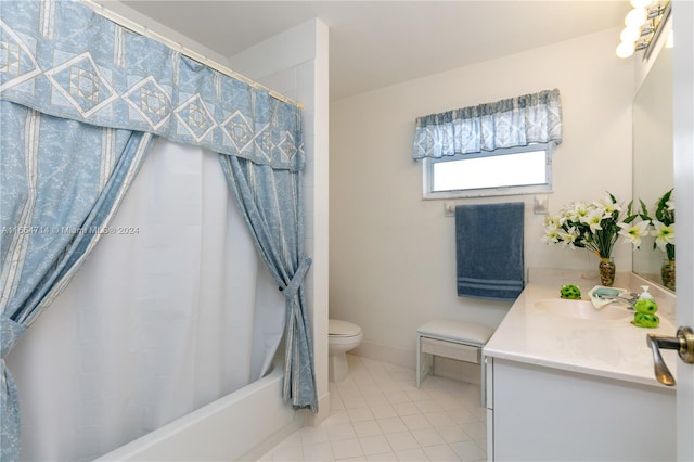 full bathroom with vanity, shower / bath combo with shower curtain, toilet, and tile patterned floors