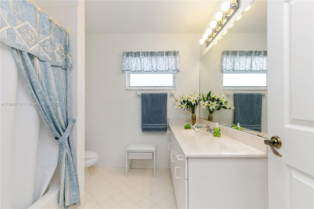 bathroom with tile patterned floors, vanity, and toilet